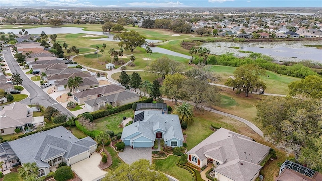 bird's eye view with a residential view, view of golf course, and a water view