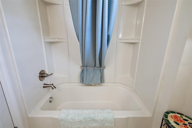 bathroom featuring shower / bath combination with curtain