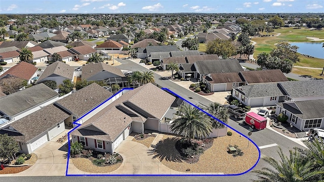 bird's eye view featuring a water view and a residential view