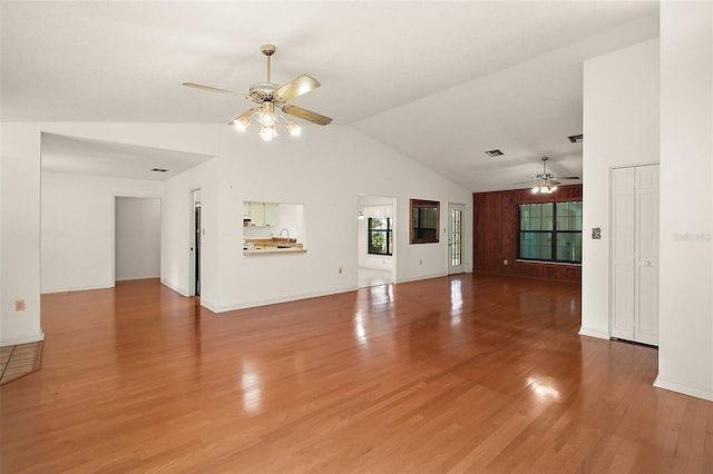 unfurnished living room featuring ceiling fan, visible vents, light wood-style flooring, and baseboards