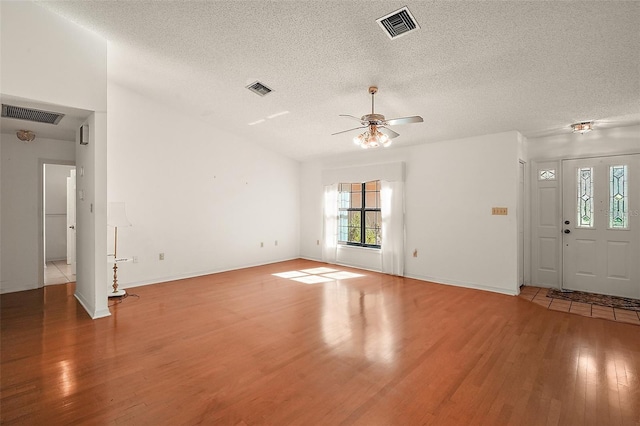 unfurnished living room with light wood-type flooring and visible vents