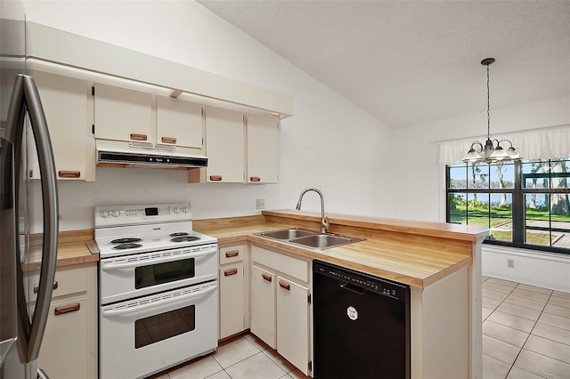 kitchen featuring range with two ovens, black dishwasher, a sink, stainless steel fridge, and under cabinet range hood