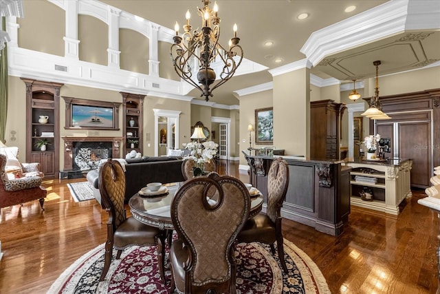 dining area with a high ceiling, a fireplace, visible vents, ornamental molding, and dark wood-style floors