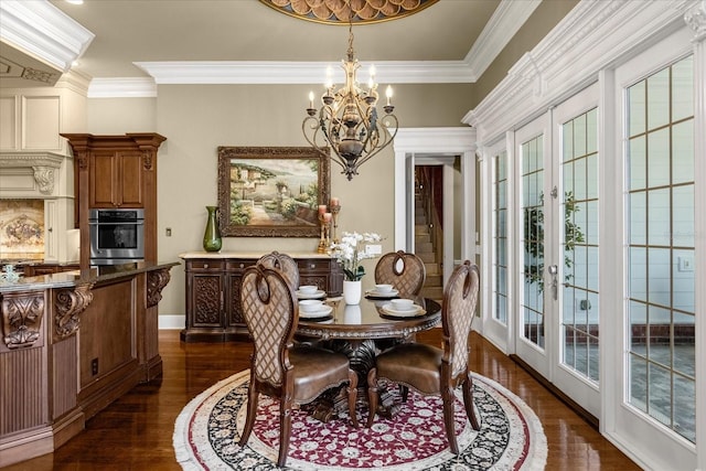 dining room with baseboards, dark wood-style flooring, crown molding, french doors, and a chandelier