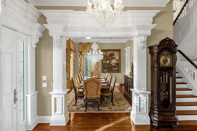 interior space featuring stairs, wood finished floors, crown molding, and an inviting chandelier