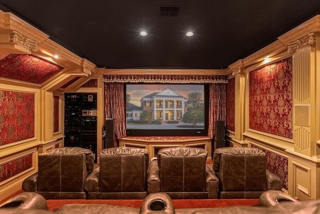 home theater with visible vents, a decorative wall, and ornamental molding