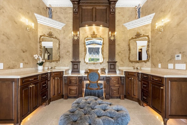 bathroom with a sink, tile patterned flooring, and wallpapered walls