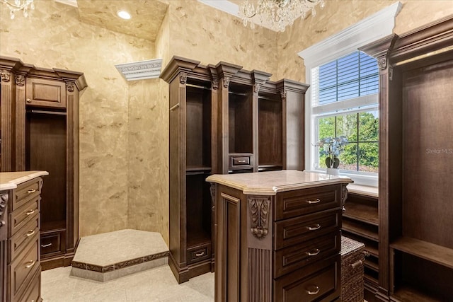 spacious closet featuring light tile patterned floors