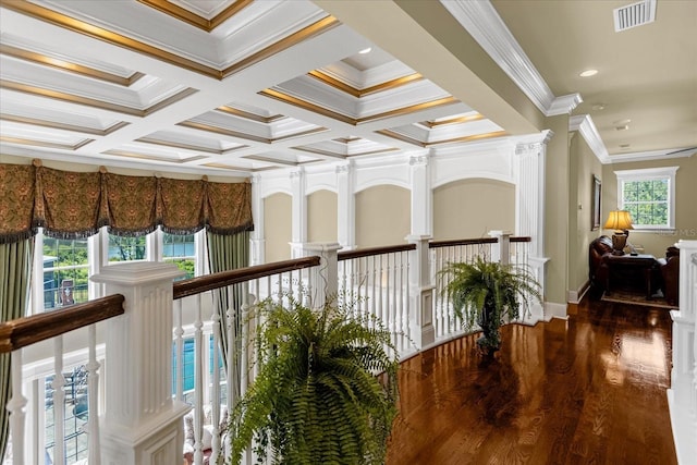 hallway featuring visible vents, coffered ceiling, ornamental molding, wood finished floors, and recessed lighting