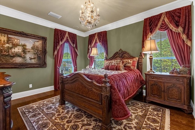 bedroom with crown molding, a notable chandelier, visible vents, wood finished floors, and baseboards