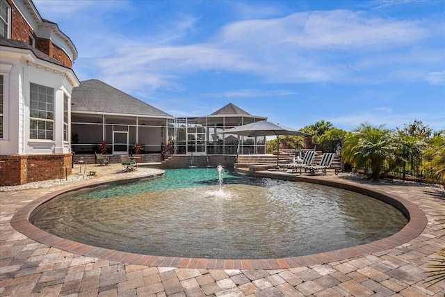 view of pool with a sunroom