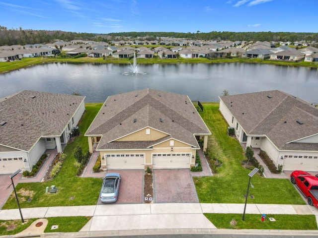 aerial view with a residential view and a water view