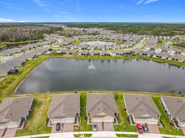 aerial view with a water view and a residential view