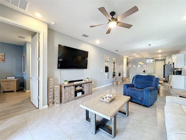 living room with visible vents and light tile patterned flooring