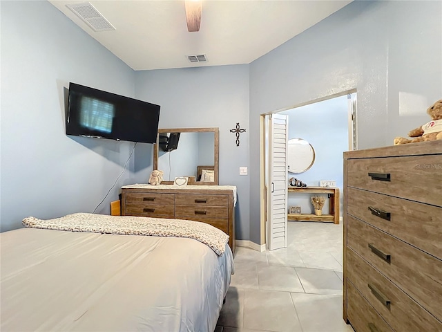 bedroom with light tile patterned floors, baseboards, visible vents, and a ceiling fan