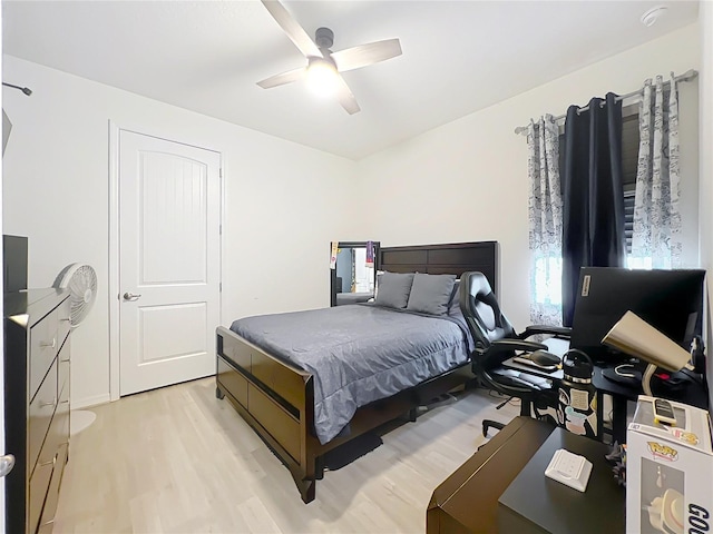 bedroom featuring light wood-type flooring and ceiling fan