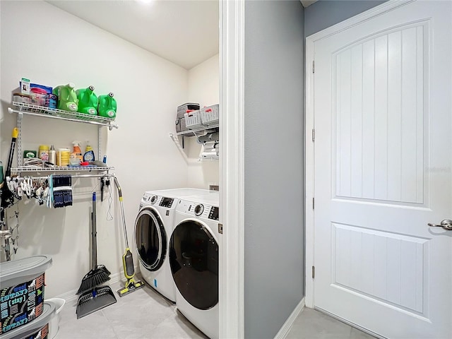 washroom featuring laundry area, independent washer and dryer, and baseboards