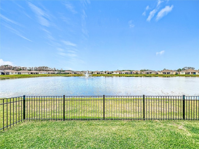 water view featuring fence and a residential view