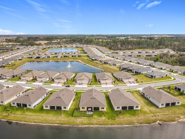 bird's eye view with a water view and a residential view