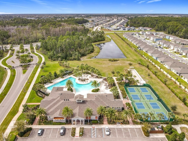 birds eye view of property with a water view