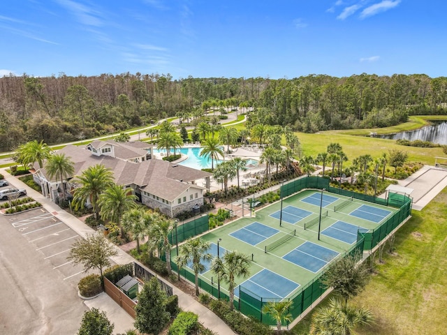 bird's eye view with a water view and a view of trees