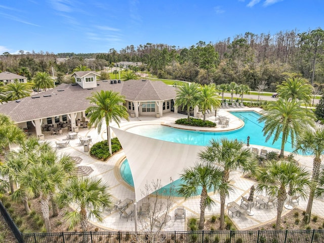 pool featuring a patio area and fence