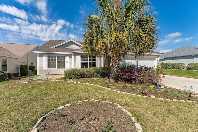 view of front of home with a garage, driveway, and a front yard