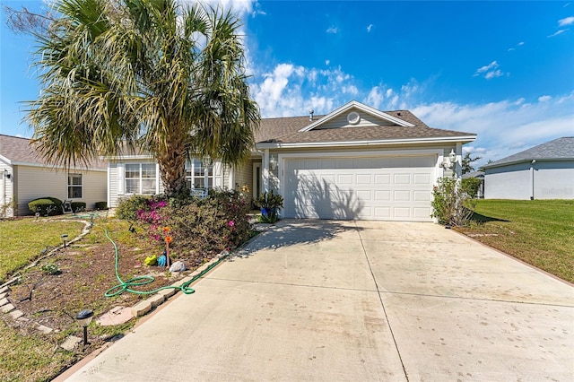 ranch-style home featuring a garage, driveway, and a front lawn