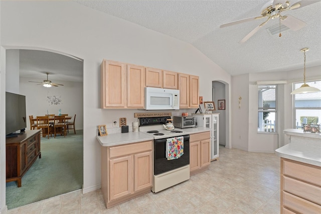 kitchen featuring arched walkways, lofted ceiling, white microwave, range with electric stovetop, and light brown cabinetry