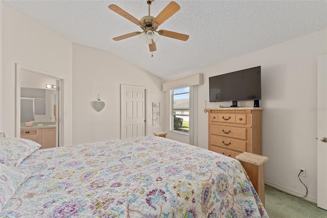 bedroom featuring vaulted ceiling, a textured ceiling, a ceiling fan, and light colored carpet