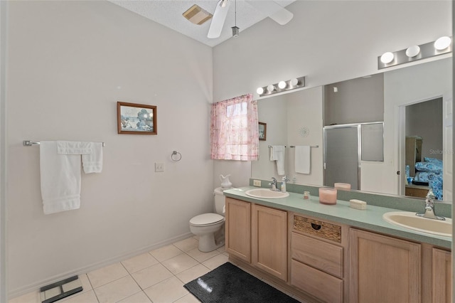 full bath with tile patterned flooring, visible vents, a sink, and a shower stall