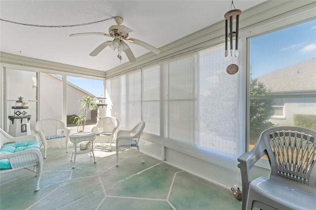 sunroom / solarium featuring ceiling fan