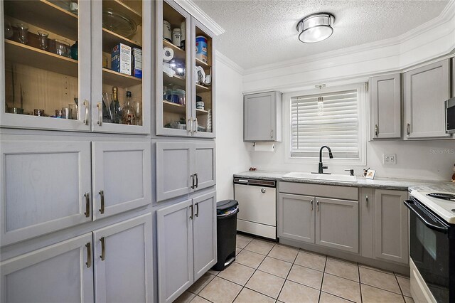 kitchen featuring range with electric stovetop, a sink, gray cabinets, dishwasher, and crown molding