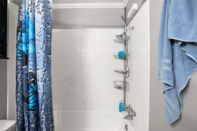 bathroom featuring ornamental molding and shower / tub combo