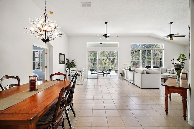 dining room with a healthy amount of sunlight, light tile patterned floors, a ceiling fan, and visible vents