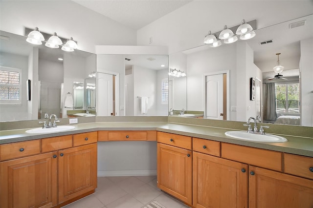 full bathroom with tile patterned floors, visible vents, and a sink