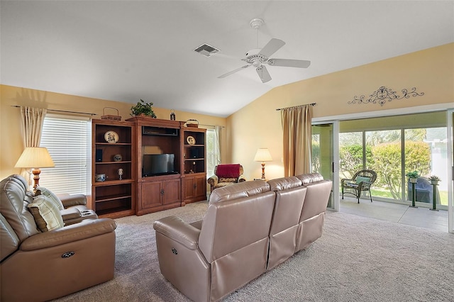 carpeted living area with vaulted ceiling, ceiling fan, and visible vents