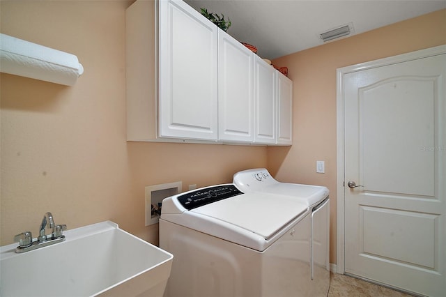 laundry area featuring cabinet space, visible vents, washer and clothes dryer, and a sink