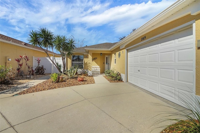 single story home featuring driveway and stucco siding