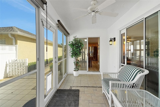 sunroom with a ceiling fan