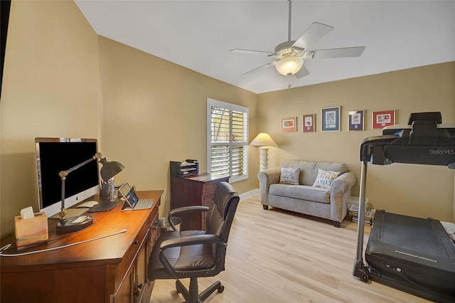 office space featuring light wood-type flooring and a ceiling fan