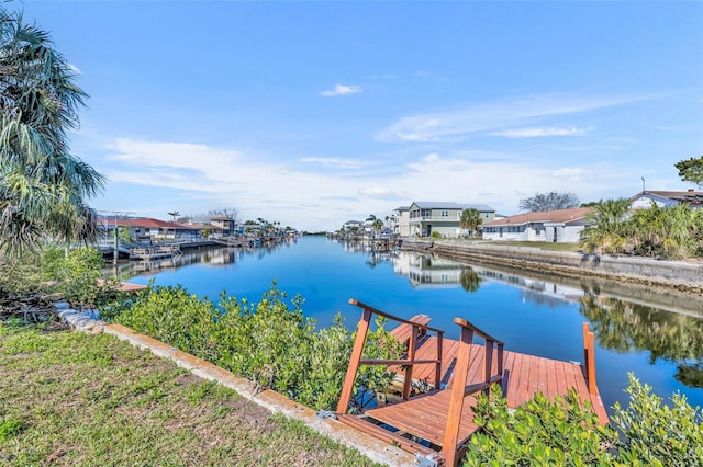 view of dock featuring a water view and a residential view