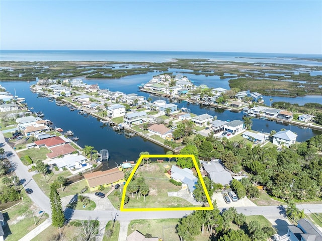 bird's eye view featuring a water view and a residential view