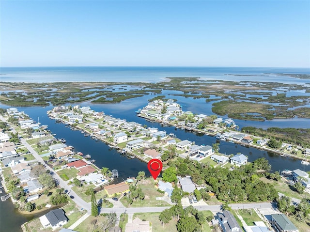 birds eye view of property with a water view and a residential view