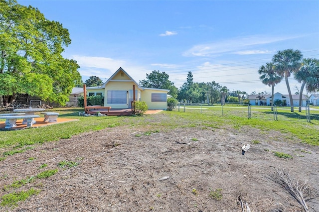 view of yard featuring fence and a wooden deck