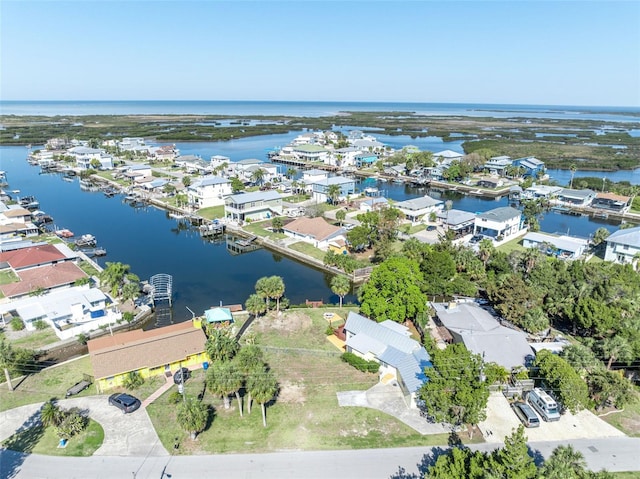 birds eye view of property with a residential view and a water view