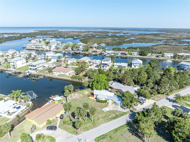 bird's eye view with a water view and a residential view