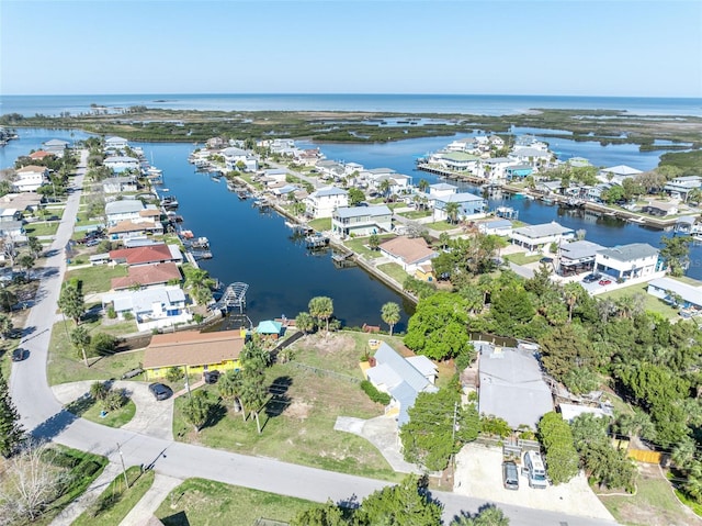 birds eye view of property featuring a residential view and a water view