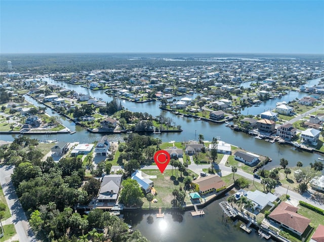 drone / aerial view with a water view and a residential view