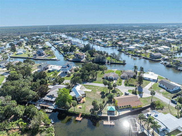 bird's eye view featuring a residential view and a water view